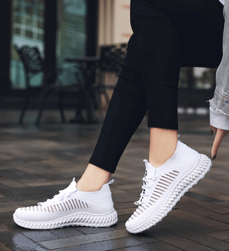 Casual lace-up breathable mesh sneakers for women, featuring flat bottoms and stylish white design, perfect for everyday comfort.